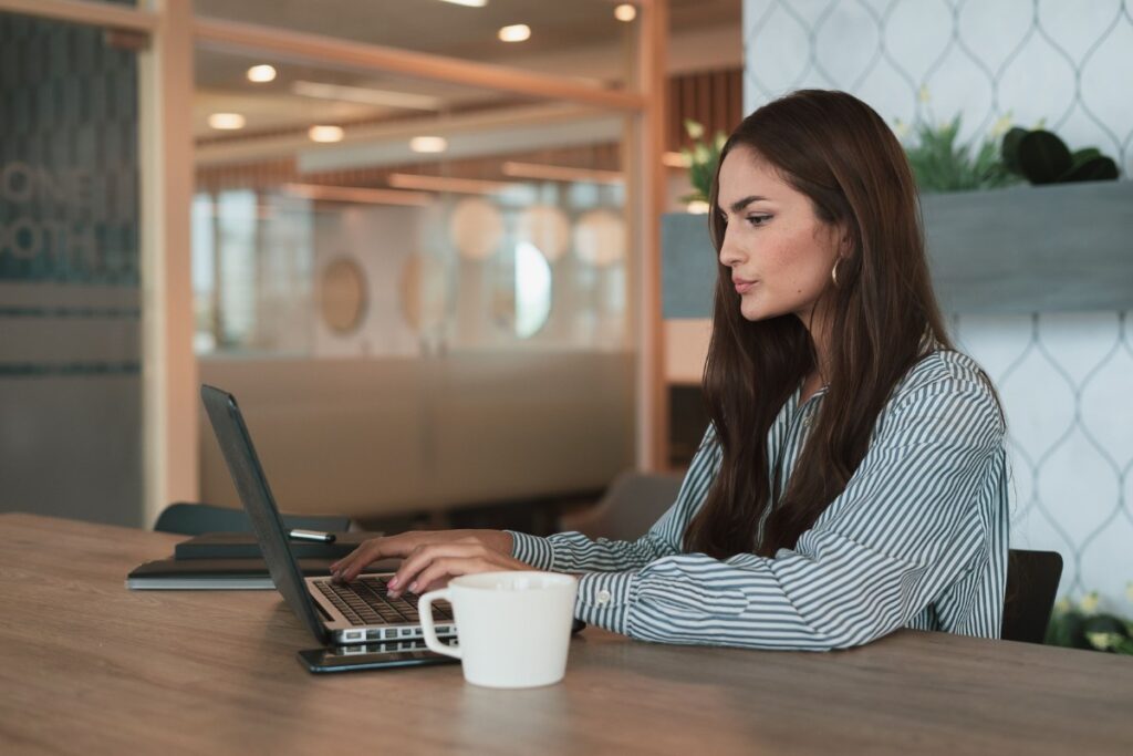 Focused while working at her desk representing the beta brain wave state of alert thinking