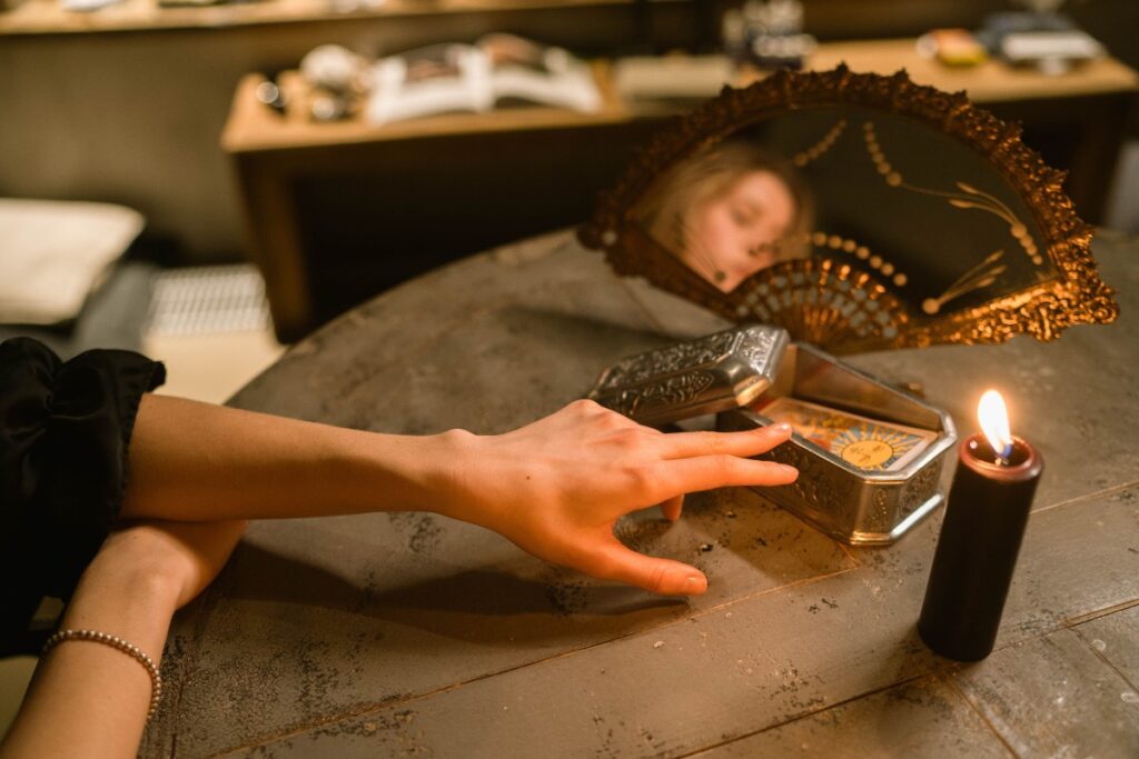Person pulling a single tarot card during a daily morning ritual practice
