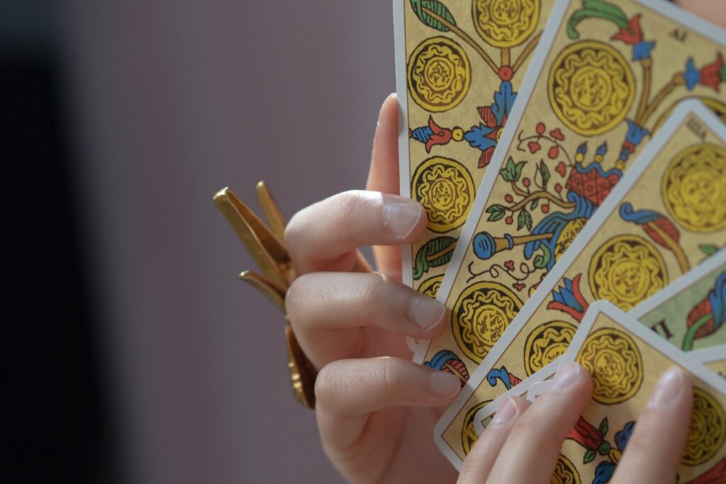 How to read tarot cards deck in her hands ready to begin a reading