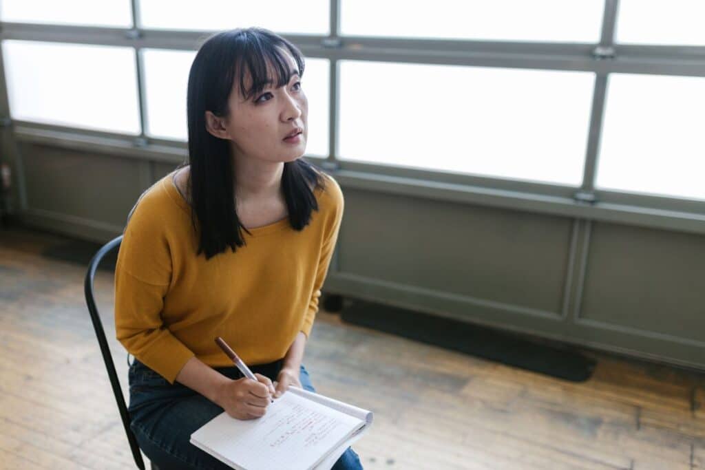 Woman looking up in thought representing the brain's reticular activating system