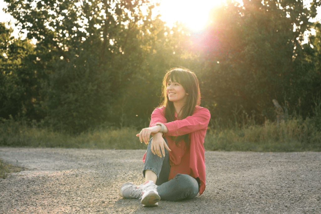 Woman sitting alone smiling peacefully